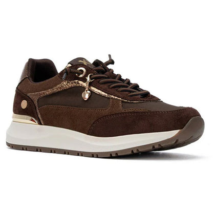 A dark brown trainer with matching brown laces, a white midsole, and gold-tone metal hardware, shown from a side profile on a white background.