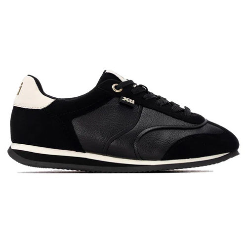 A black low-top trainers with mixed leather and suede panels, black laces, a white midsole stripe, and a small silver XHI logo on the side, shown against a plain white background.