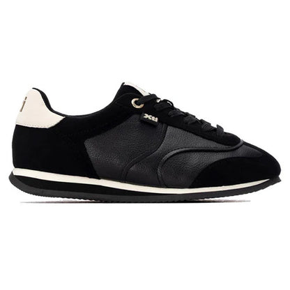 A black low-top trainers with mixed leather and suede panels, black laces, a white midsole stripe, and a small silver XHI logo on the side, shown against a plain white background.