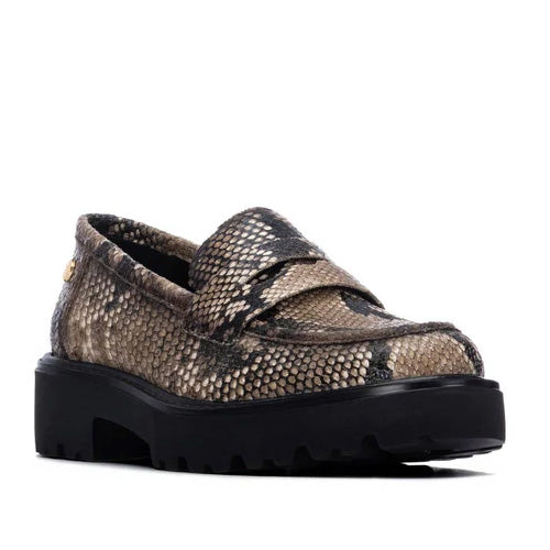 A single platform loafer in a brown and beige snakeskin pattern with a thick black lug sole, shown from a side profile on a white background.