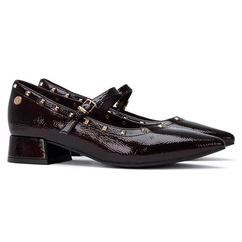 A pair of burgundy patent leather Mary Jane shoes with gold-tone studs and buckles, shown from a side profile on a white background.