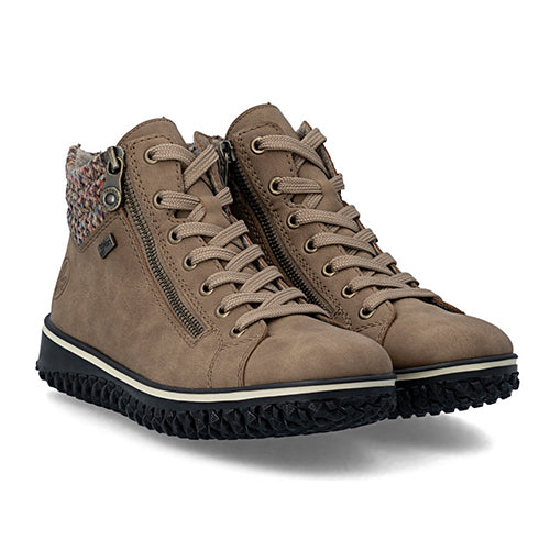 Pair of brown suede boots with zippers on a white background